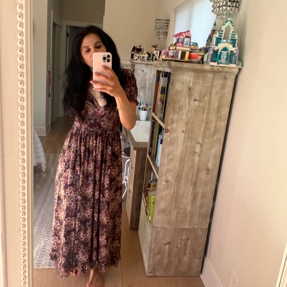 NWOT. Such a pretty Free People dress with corset styling.